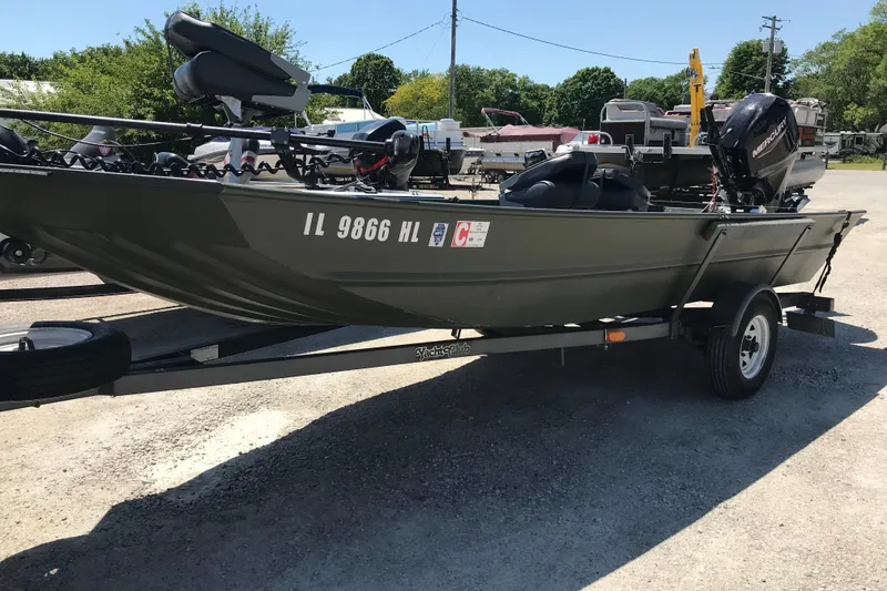 Slide: The Image of 1992 Alweld 1856VV Large Vee Bottom boat on trailer, parked outdoors. - 19