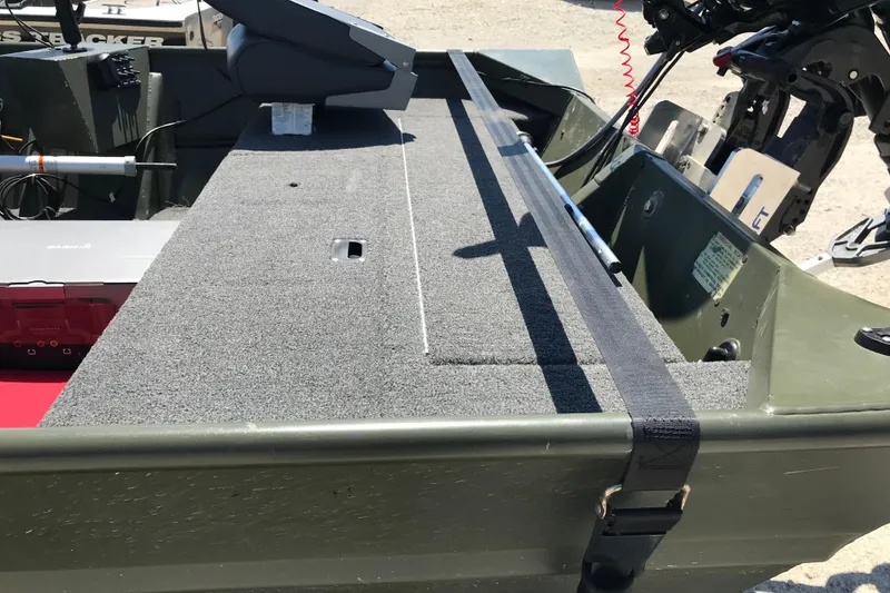 Slide: The Image of 1992 Alweld 1856VV Large Vee Bottom boat interior with motor and seating. - 21