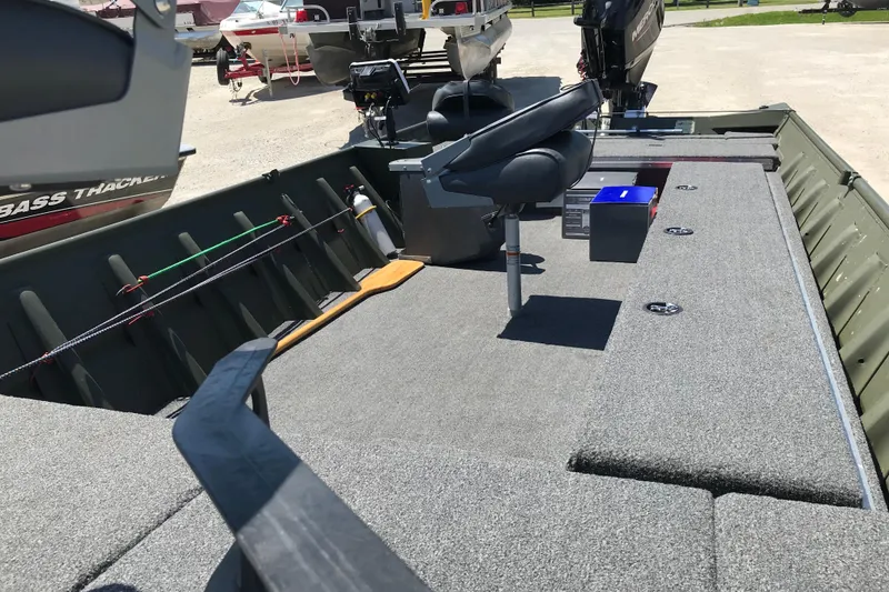 Slide: The Image of 1992 Alweld 1856VV Large Vee Bottom boat with fishing gear and seating. - 23