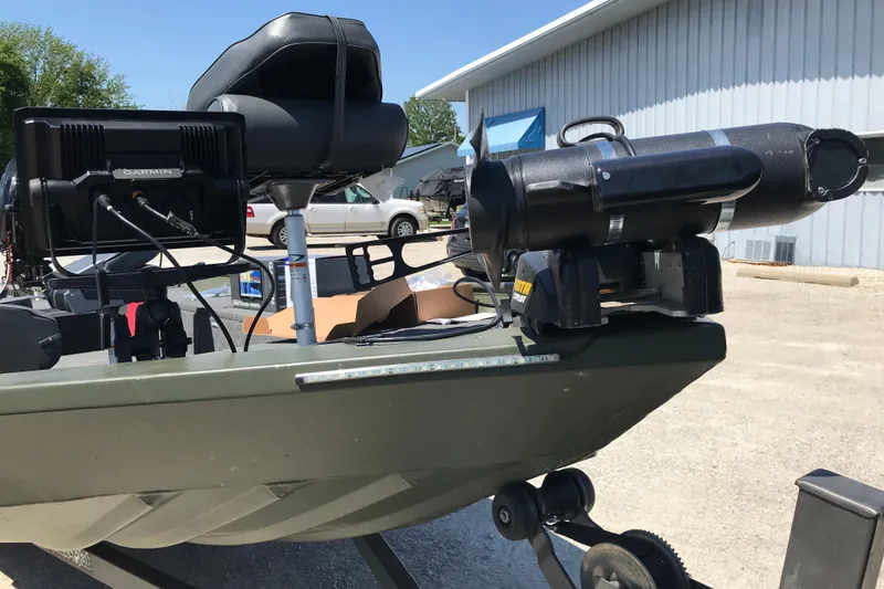 Slide: The Image of 1992 Alweld 1856VV Large Vee Bottom boat with Garmin equipment and motor, parked outdoors. - 42