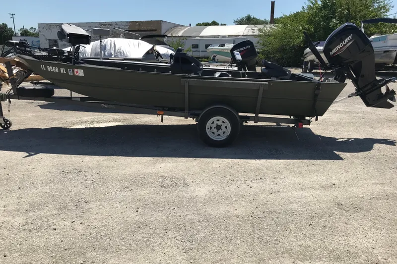 The Image of 1992 Alweld 1856VV Large Vee Bottom boat on trailer, equipped with Mercury outboard motor. - 5