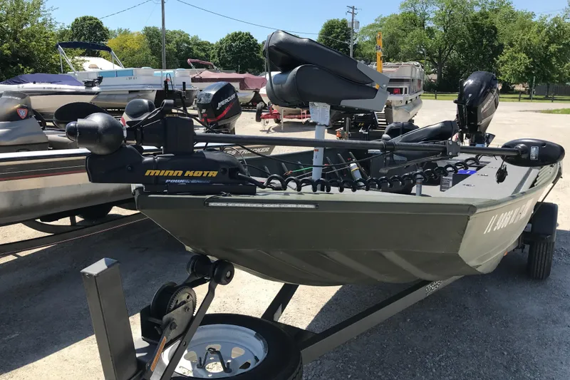 Slide: The Image of 1992 Alweld 1856VV Large Vee Bottom boat with Minn Kota trolling motor on trailer. - 6
