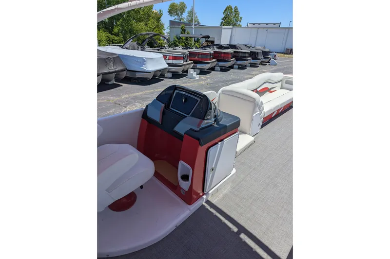Slide: The Image of 2025 PlayCraft 3000 XTREME pontoon boat interior with seating and control panel. - 4
