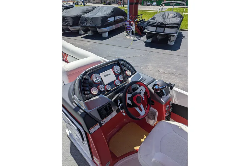 Slide: The Image of Cockpit of 2025 PlayCraft 3000 XTREME boat with modern controls and steering wheel. - 6