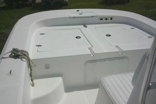 Slide: The Image of 2009 Carolina Skiff 198 DLV Elite boat deck with storage compartments and seating. - 10