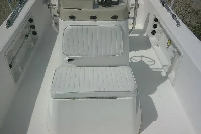 Slide: The Image of 2009 Carolina Skiff 198 DLV Elite boat interior with white seating and console. - 11