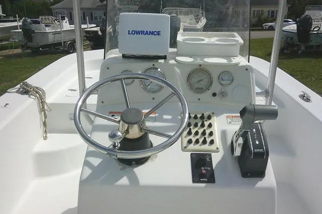 Slide: The Image of 2009 Carolina Skiff 198 DLV Elite boat dashboard with steering wheel and Lowrance equipment. - 15