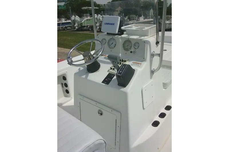 Slide: The Image of 2009 Carolina Skiff 198 DLV Elite boat console with steering wheel and gauges. - 16