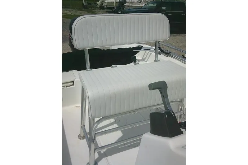 Slide: The Image of 2009 Carolina Skiff 198 DLV Elite boat seat with white upholstery and control lever. - 17