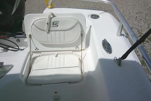Slide: The Image of 2009 Carolina Skiff 198 DLV Elite boat seat with white upholstery and stainless steel railing. - 19