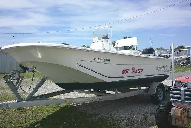 Slide: The Image of 2009 Carolina Skiff 198 DLV Elite boat on trailer, parked outdoors. - 2
