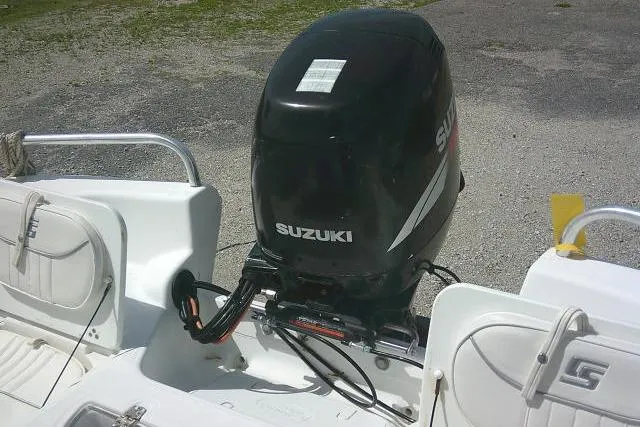 Slide: The Image of 2009 Carolina Skiff 198 DLV Elite with Suzuki outboard motor, rear view. - 21