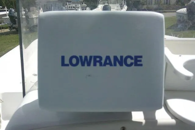 Slide: The Image of Lowrance equipment on 2009 Carolina Skiff 198 DLV Elite boat dashboard. - 22