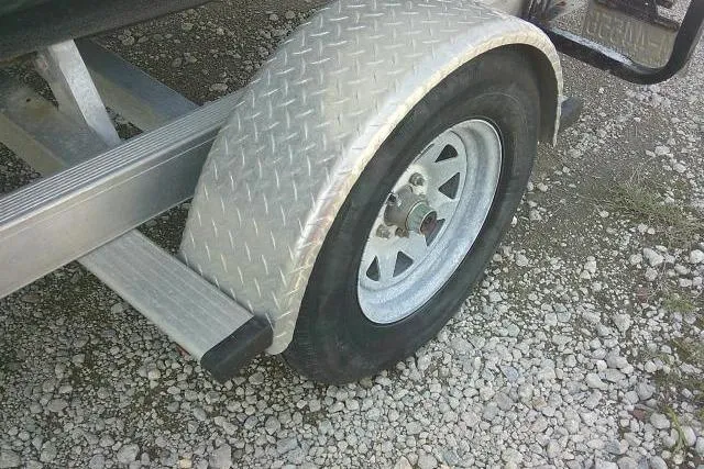 Slide: The Image of Trailer wheel with diamond plate fender for 2009 Carolina Skiff 198 DLV Elite. - 4