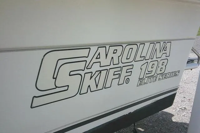 Slide: The Image of 2009 Carolina Skiff 198 DLV Elite boat logo on hull. - 5