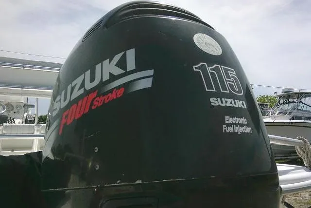 Slide: The Image of Suzuki 115 outboard motor on a 2009 Carolina Skiff 198 DLV Elite boat. - 7