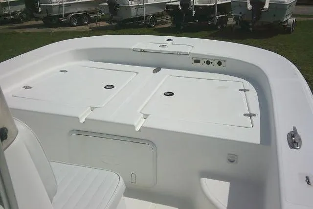 Slide: The Image of 2009 Carolina Skiff 198 DLV Elite boat interior with storage compartments and seating. - 9