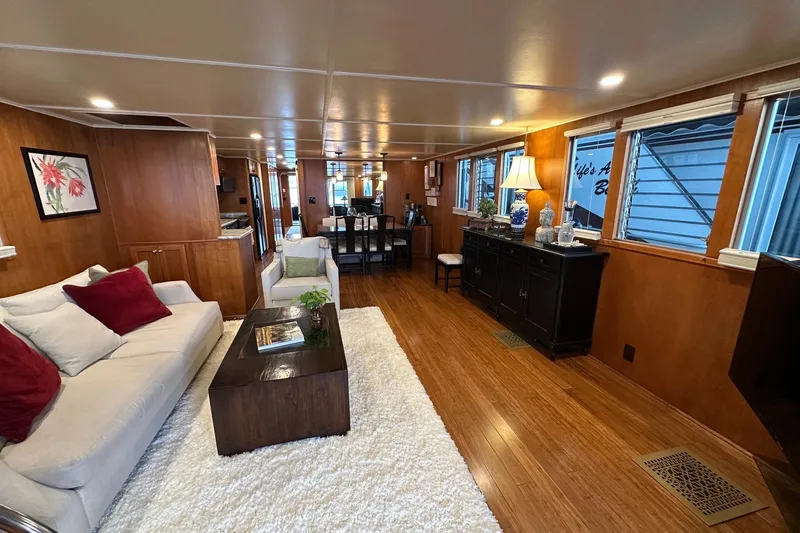 Slide: The Image of Luxurious interior of a 1993 Lazy Days 16x65 houseboat with elegant furnishings and wood paneling. - 2