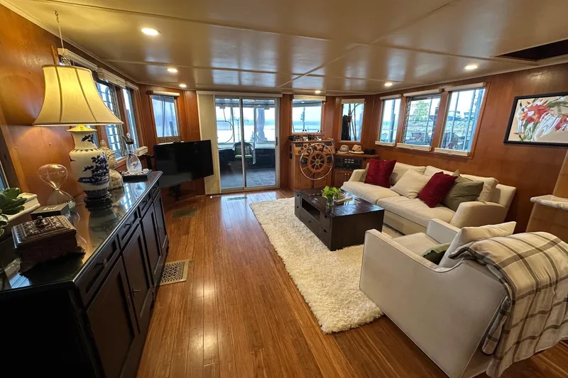 Slide: The Image of Luxurious 1993 Lazy Days 16x65 houseboat interior with cozy living area and elegant decor. - 3