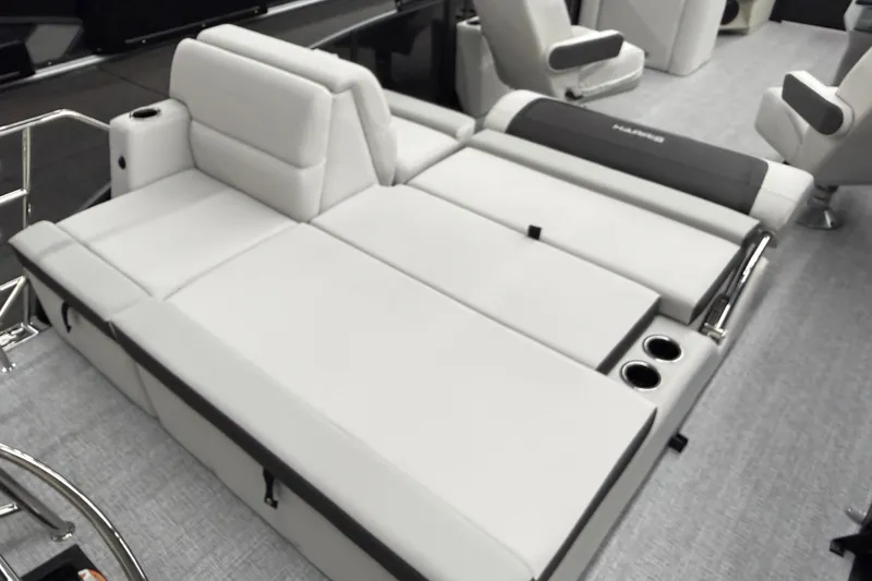 Slide: The Image of Luxurious seating on 2026 Harris Cruiser 210 SLDH pontoon boat, featuring plush cushions and cup holders. - 10