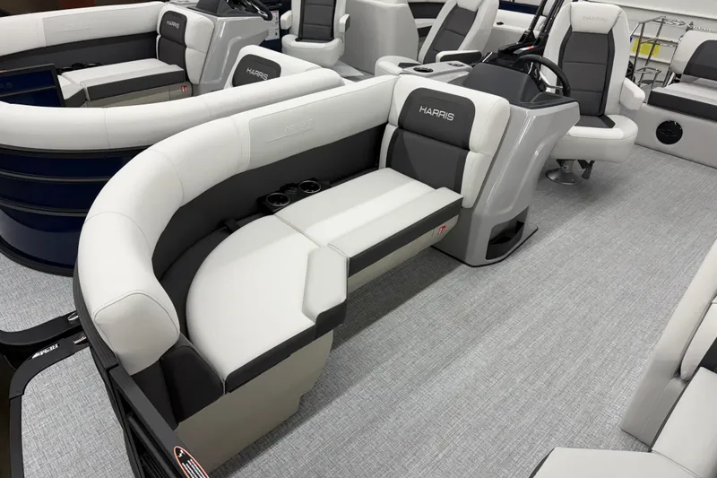 Slide: The Image of 2026 Harris Cruiser 210 SLDH pontoon boat interior with plush seating and modern design. - 4