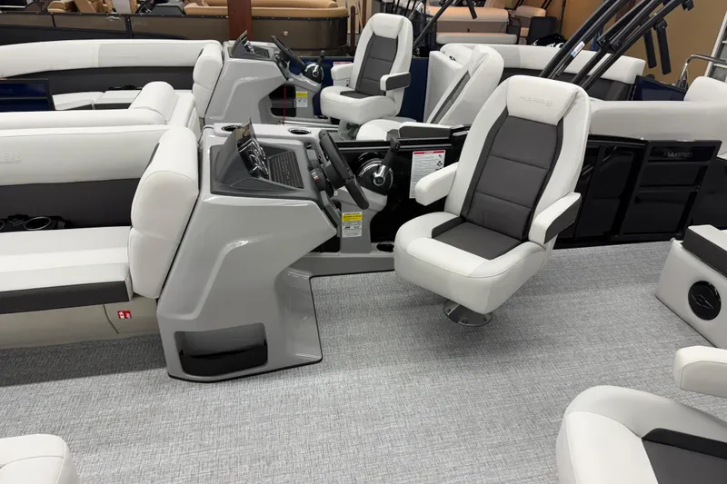 Slide: The Image of 2026 Harris Cruiser 210 SLDH boat interior with modern seating and sleek design. - 5