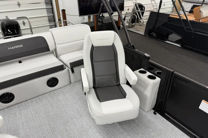 Slide: The Image of 2026 Harris Cruiser 210 SLDH boat interior with luxurious seating and modern design. - 6