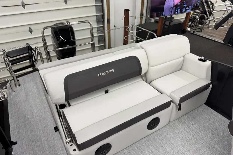 Slide: The Image of 2026 Harris Cruiser 210 SLDH boat interior with white seating and modern design. - 7
