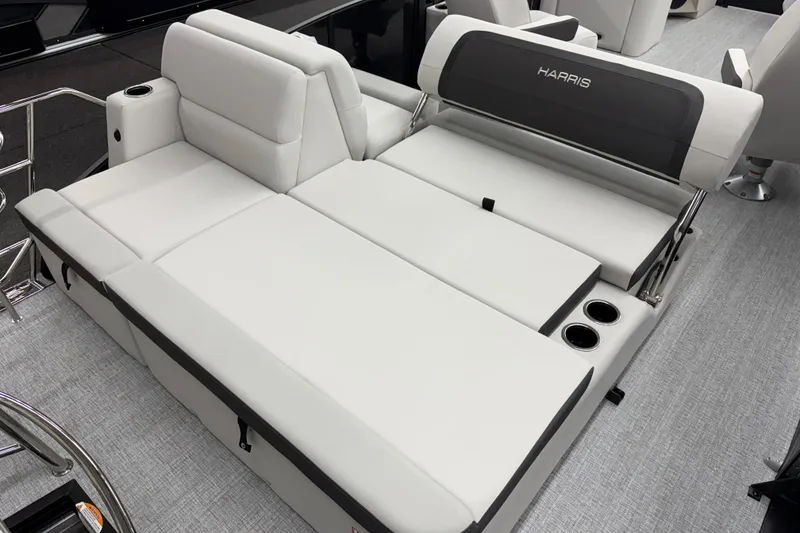 Slide: The Image of 2026 Harris Cruiser 210 SLDH boat interior with luxurious white seating and cup holders. - 9