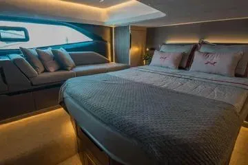 Slide: The Image of Luxurious interior of 2025 NX Boats NX44 PININFARINA with elegant bedding and modern design. - 13