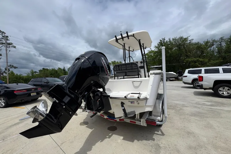 Slide: The Image of 2026 Sea Born LX21 Center Console boat with powerful outboard motor on trailer. - 11