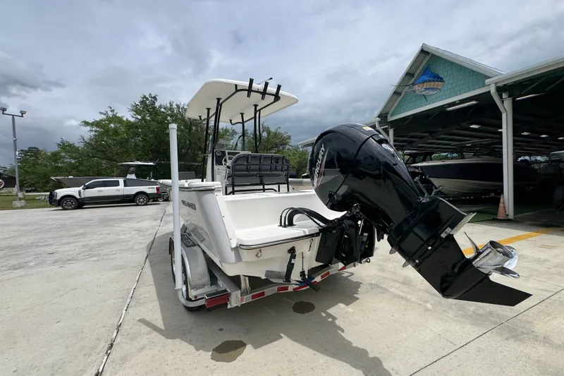 Slide: The Image of 2026 Sea Born LX21 Center Console boat with Mercury outboard motor on trailer. - 13