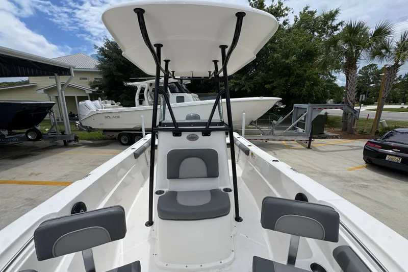 Slide: The Image of 2026 Sea Born LX21 Center Console boat with seating, parked outdoors. - 19