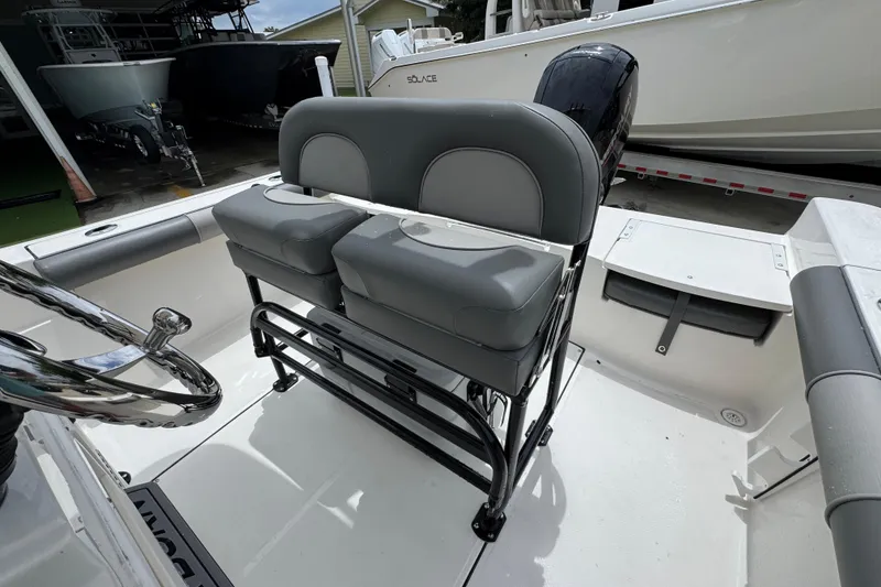 Slide: The Image of 2026 Sea Born LX21 Center Console boat interior with dual seating and steering wheel. - 22