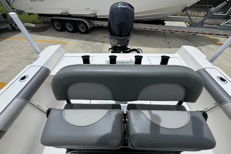 Slide: The Image of 2026 Sea Born LX21 Center Console boat with dual seats and outboard motor. - 23