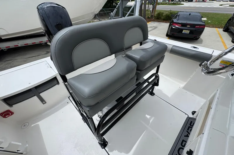 Slide: The Image of 2026 Sea Born LX21 Center Console boat with dual gray seats and sleek design. - 24