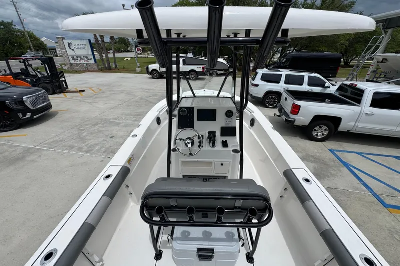 Slide: The Image of 2026 Sea Born LX21 Center Console boat in a parking lot, showcasing interior and helm. - 28