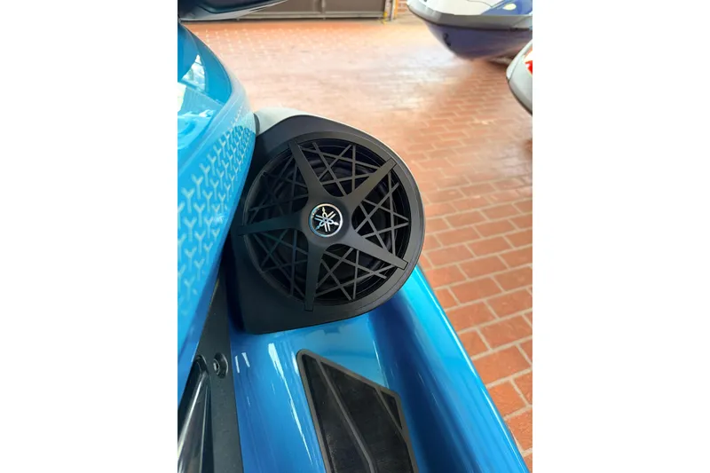 Slide: The Image of 2026 Yamaha WaveRunner FX Cruiser SVHO speaker detail on blue watercraft. - 11
