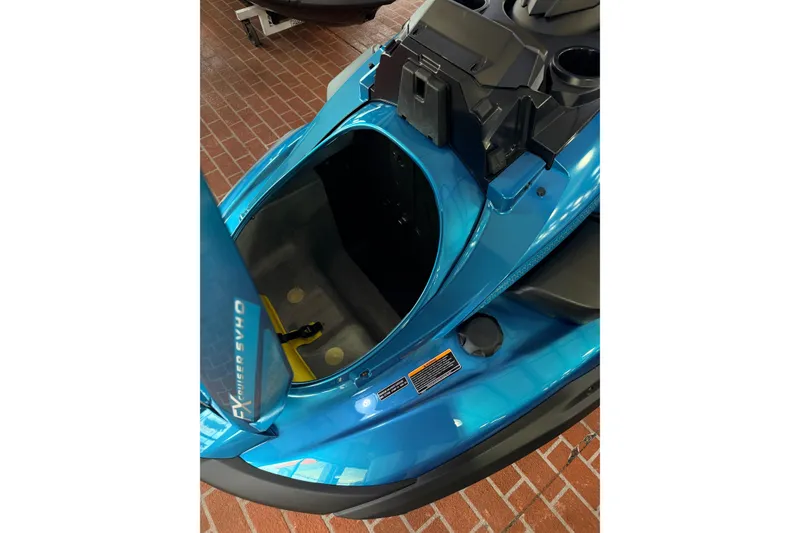 Slide: The Image of 2026 Yamaha WaveRunner FX Cruiser SVHO in blue, showcasing open storage compartment. - 13