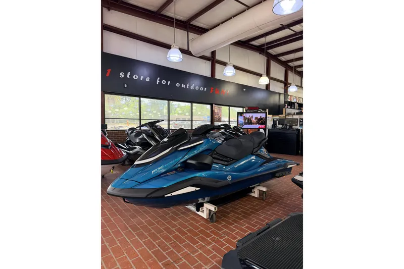 Slide: The Image of 2026 Yamaha WaveRunner FX Cruiser SVHO displayed in a showroom with brick flooring. - 2