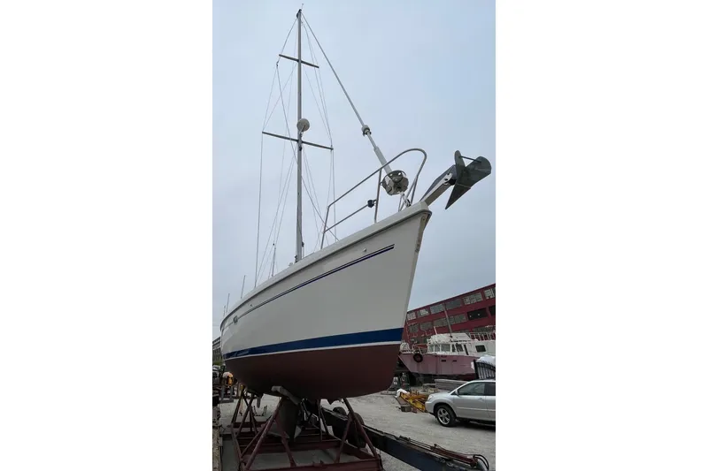 Slide: The Image of Sailboat Catalina 380, 2001 model, on dry dock for maintenance. - 2
