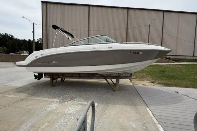 The Image of 2007 Chaparral 236 SSi boat on display, gray and white exterior, parked outdoors. - 1