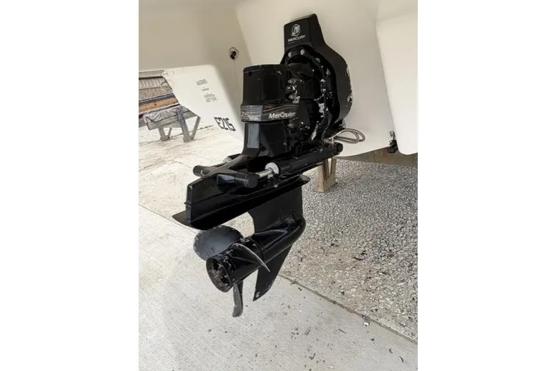 Slide: The Image of 2007 Chaparral 236 SSi boat with MerCruiser outdrive, displayed on concrete surface. - 10