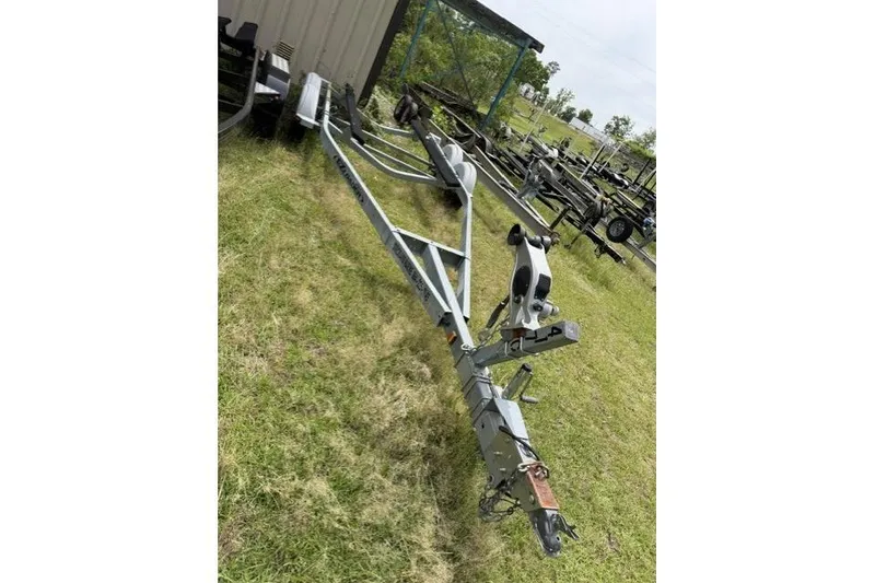 Slide: The Image of Trailer for 2007 Chaparral 236 SSi boat on grassy area. - 14