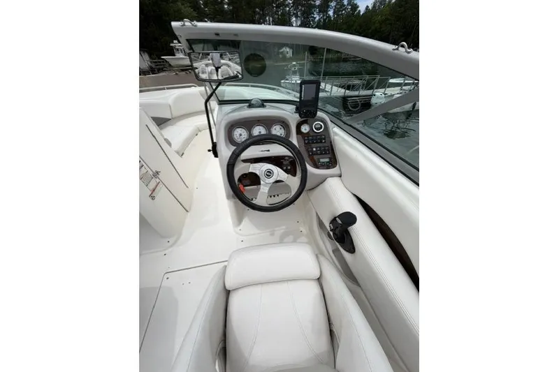 Slide: The Image of 2007 Chaparral 236 SSi boat cockpit with steering wheel and dashboard controls. - 5
