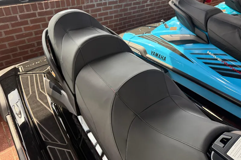Slide: The Image of 2026 Yamaha WaveRunner FX Limited SVHO with sleek black and blue design in showroom. - 17