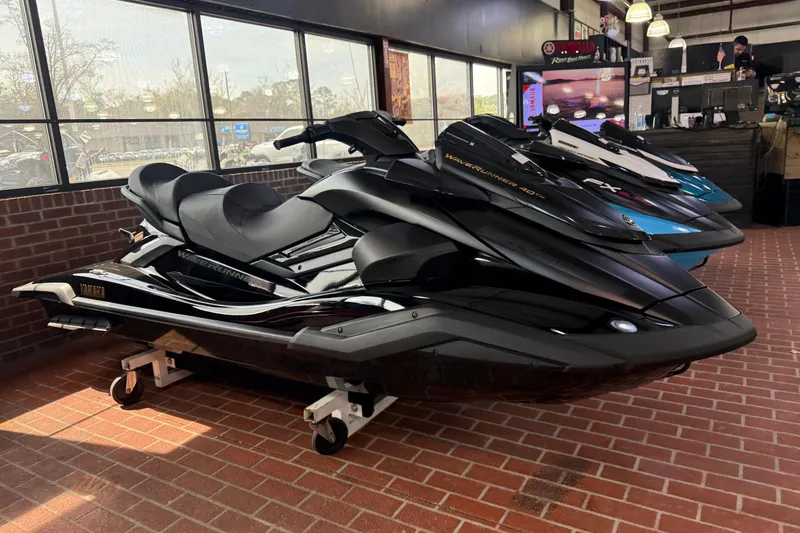 Slide: The Image of 2026 Yamaha WaveRunner FX Limited SVHO in showroom, sleek black design on display. - 3