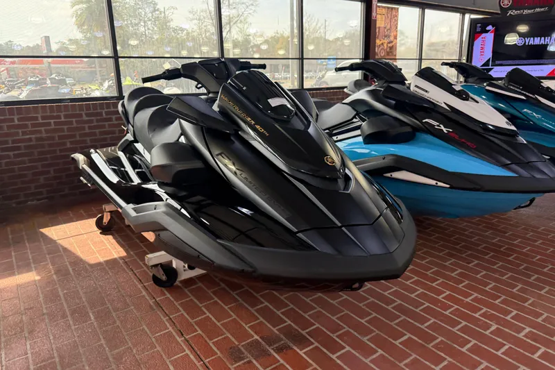 Slide: The Image of 2026 Yamaha WaveRunner FX Limited SVHO in showroom, sleek black design, displayed indoors. - 5