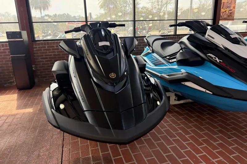 Slide: The Image of 2026 Yamaha WaveRunner FX Limited SVHO in showroom, sleek black design, brick floor background. - 6