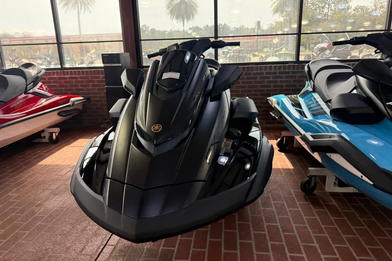 Slide: The Image of 2026 Yamaha WaveRunner FX Limited SVHO in showroom, sleek black design, brick floor background. - 7